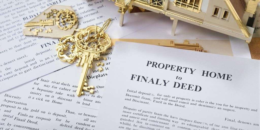 Thai house and key with legal documents.