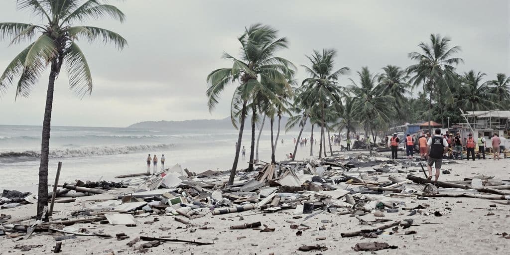 Illustration of a beach strewn with debris after a tsunami