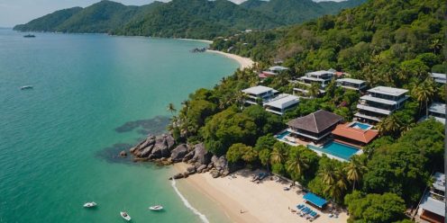 Aerial view of Phuket beachfront properties and lush landscapes.