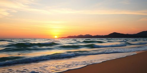 Phuket beach at sunset with calm waves.