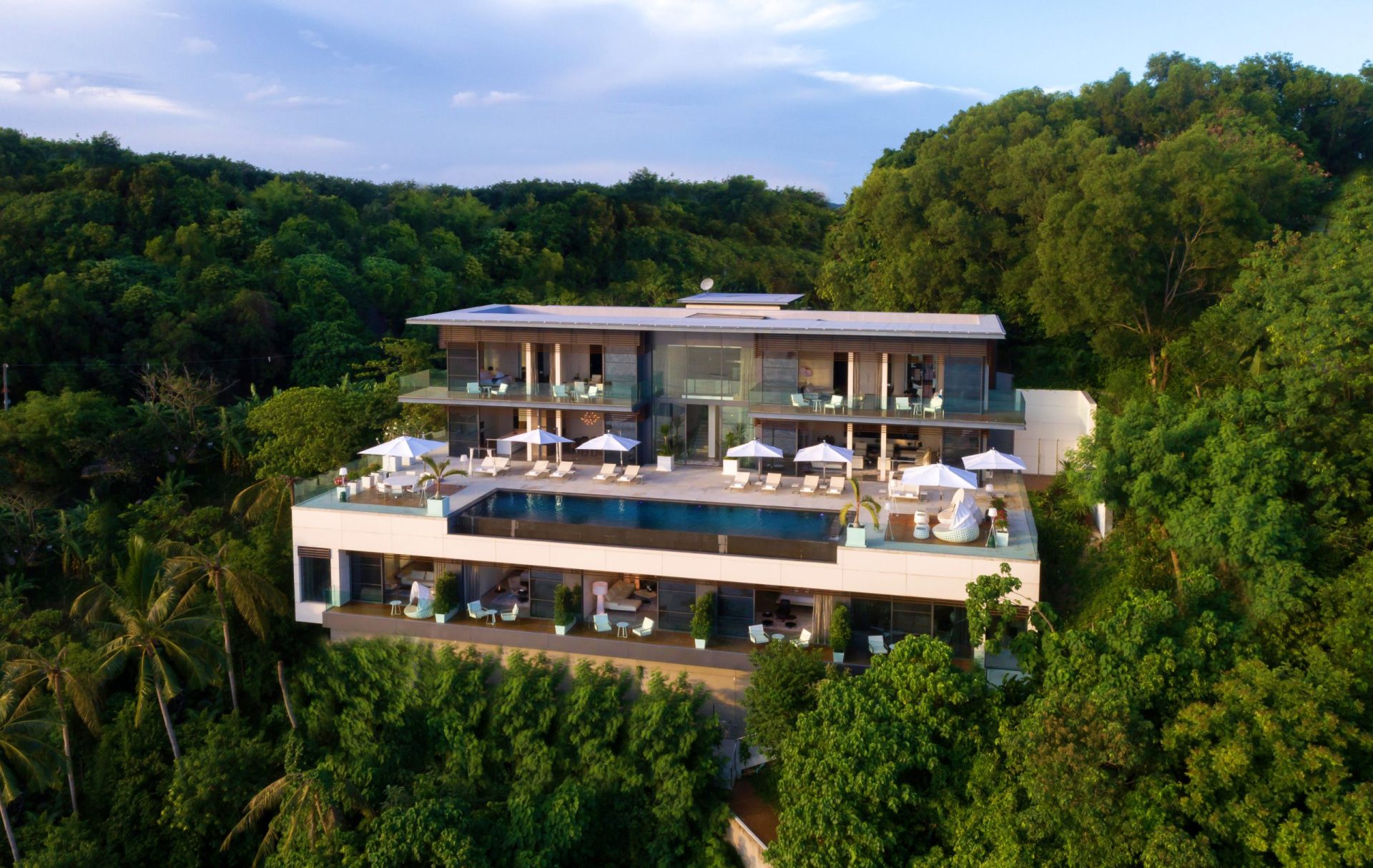 Peaceful villa retreat with private pool and green landscape.