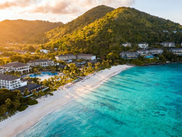Phuket island coastline with resorts and ocean.