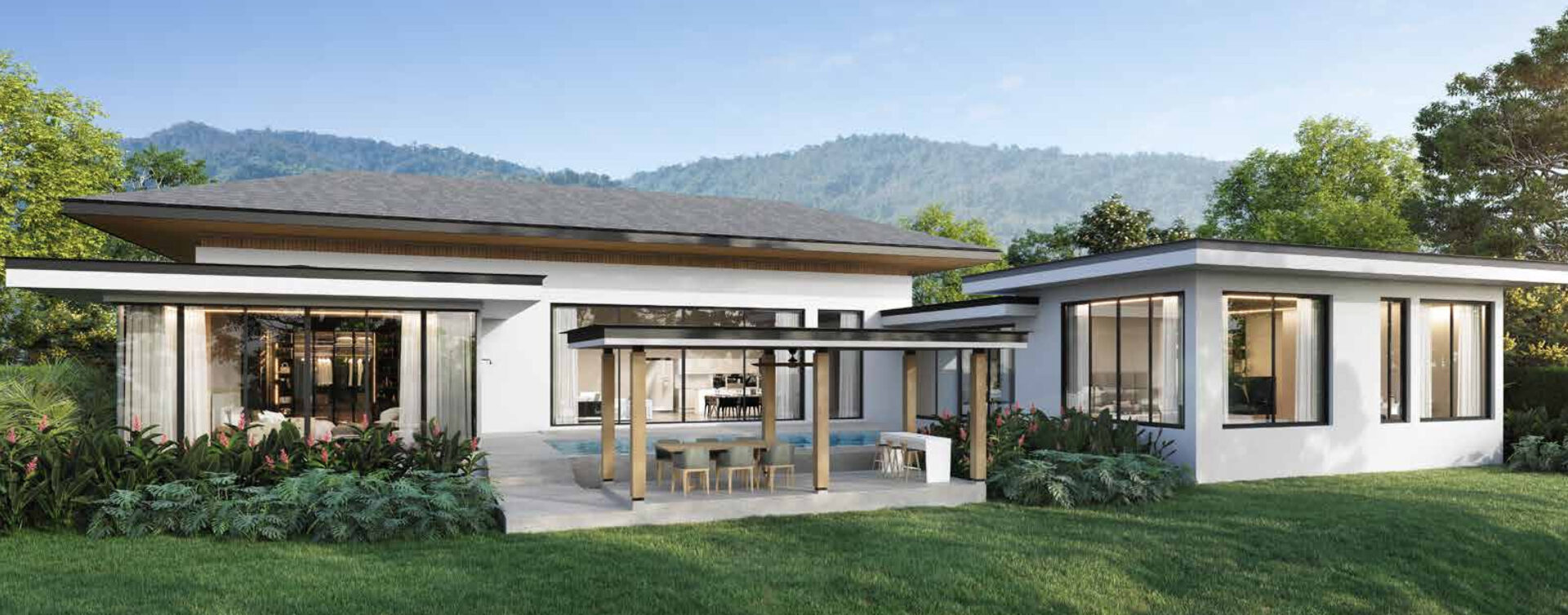 Modern single-story house with flat roof, large glass walls, and a covered poolside dining area in a landscaped yard with mountains in the background.