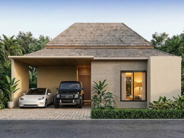 Modern single-story house with a wooden shingle roof; driveway under a carport holds a white sedan and a black SUV, surrounded by tropical plants.