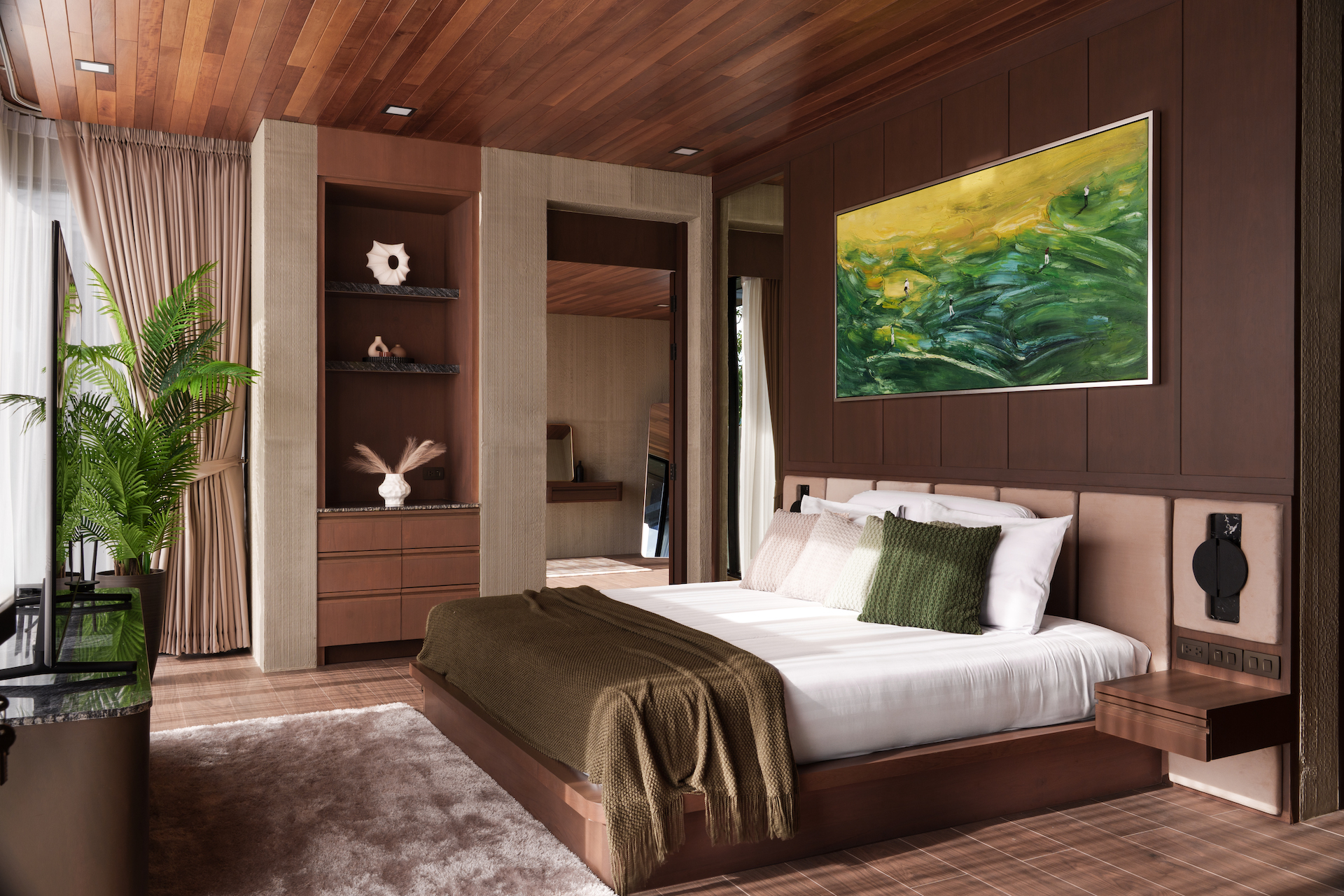 Luxurious bedroom with dark wood paneling, a large bed with white linens and green throw pillows, and a green-yellow abstract painting overheadon the wall.