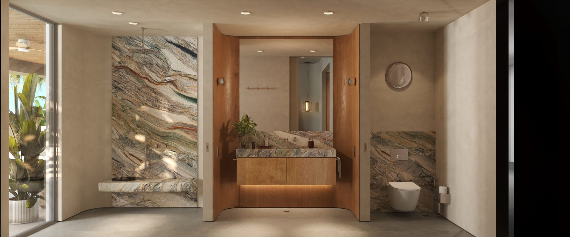 Spa-style bathroom featuring marble walls, a wooden vanity, and a wall-hung toilet with a large mirror above the sink; natural light from the left windowed wall.