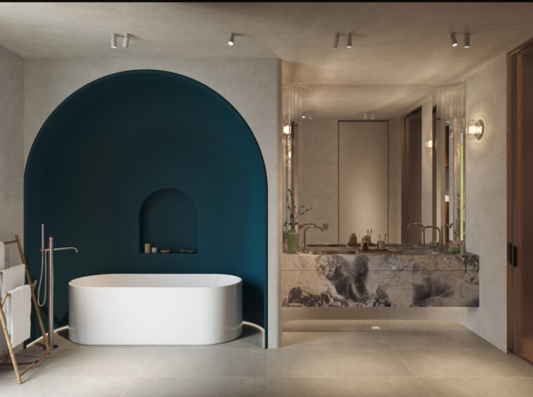 Modern bathroom with a white freestanding tub in a teal curved alcove and a marble vanity with a large mirror.