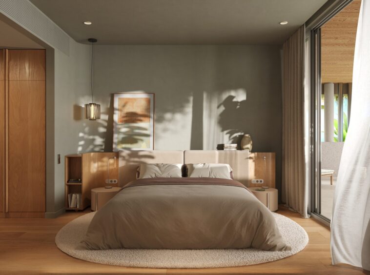 Modern bedroom with a low wooden headboard, taupe bedding, and sliding glass doors to a sunny patio.