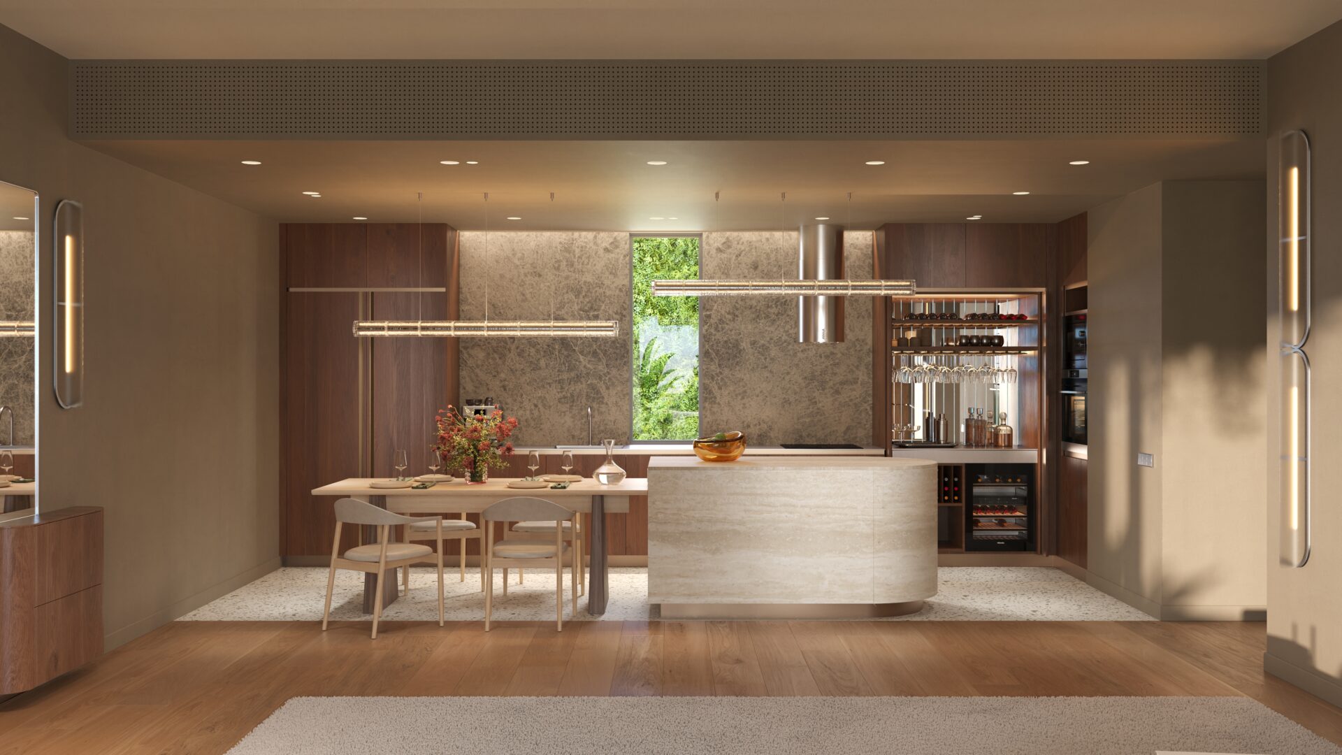 Open-plan kitchen and dining area with an oval island, wooden cabinets, and warm pendant lighting.