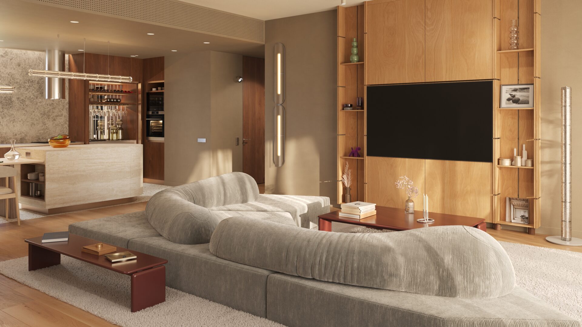 Open-plan living area with a large gray sectional sofa facing a built-in wooden media wall and flat-screen TV, surrounded by shelves and decor.