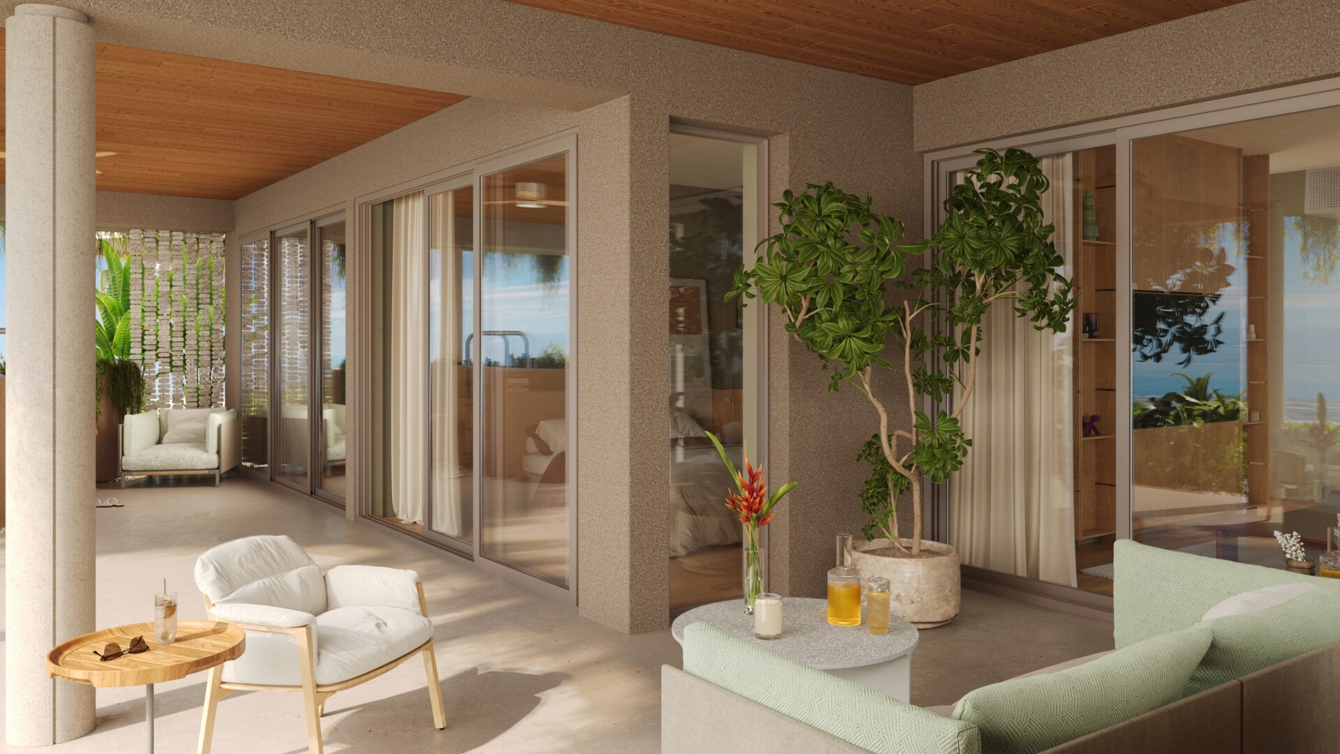 Sunlit covered patio with white cushioned seating, round wooden table, and potted plants, ocean view in the distance.