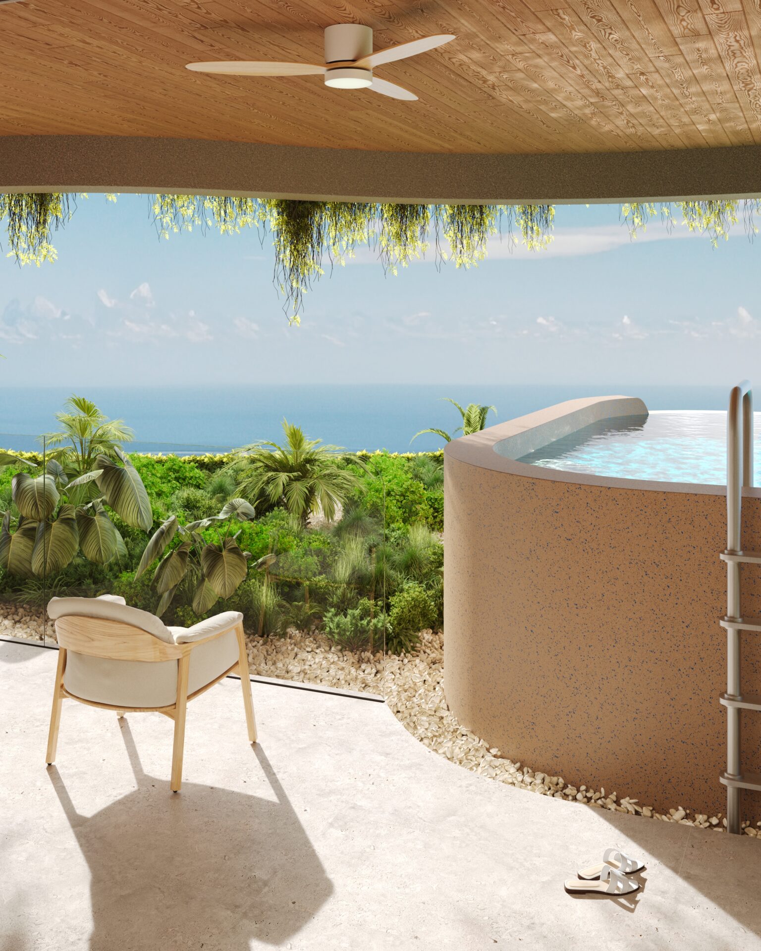 Patio with a beige chair and sandals, overlooking a tropical garden and the blue ocean beyond at sunset light.