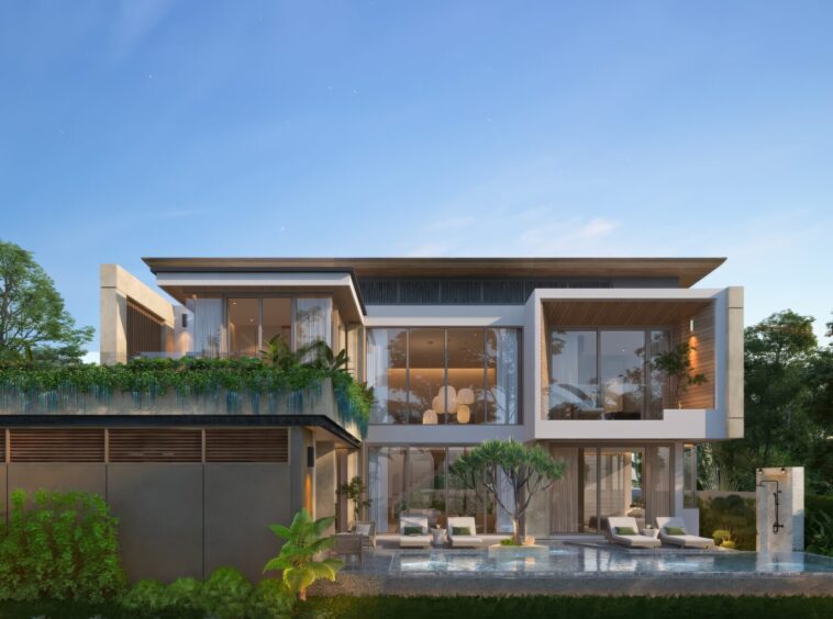Modern two-story house with large glass walls, outdoor seating by a rectangular pool, surrounded by lush gardens.