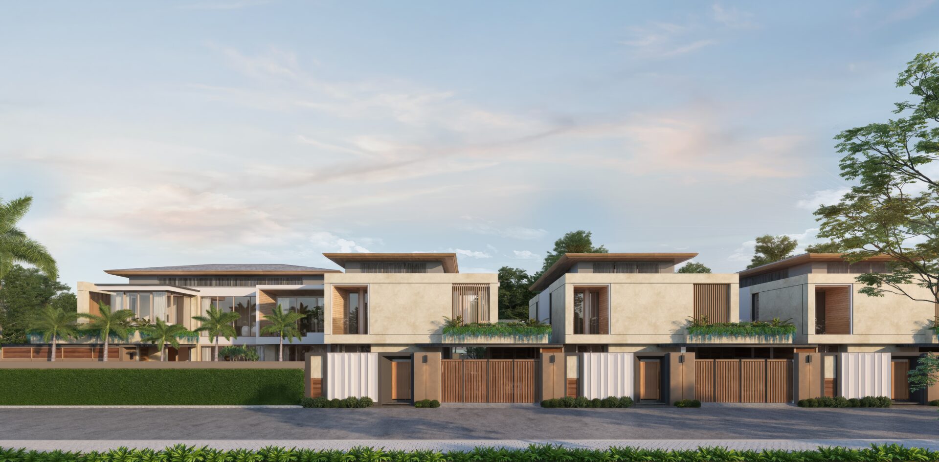 Row of contemporary two-story townhouses with beige stucco, wooden accents, balconies, and manicured front landscaping under a blue sky.