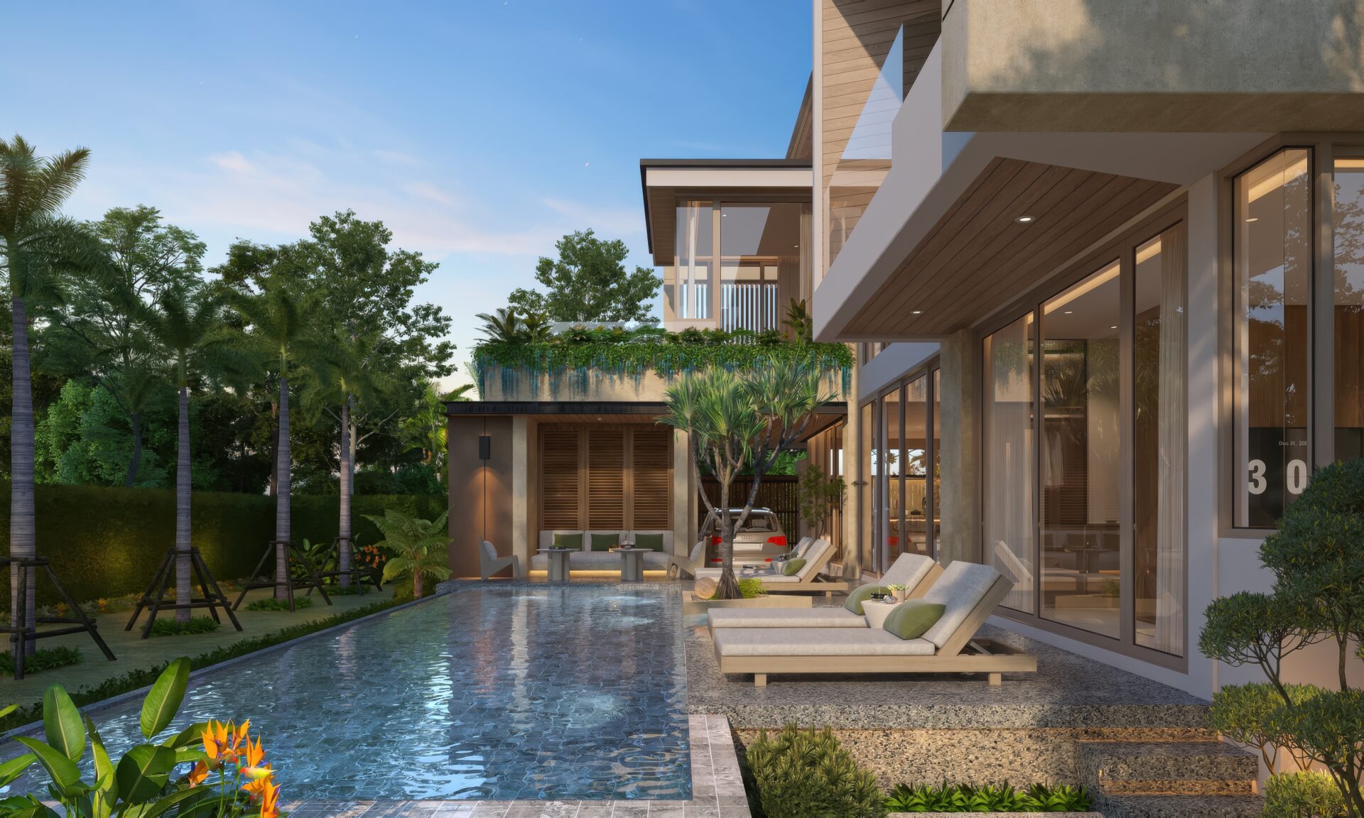 Modern villa with glass walls, outdoor lounge by a rectangular pool and tropical plants.