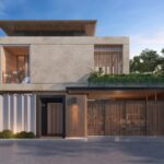 Modern two‑story concrete house with wooden accents, a gated entrance, and greenery along a low wall at the front.