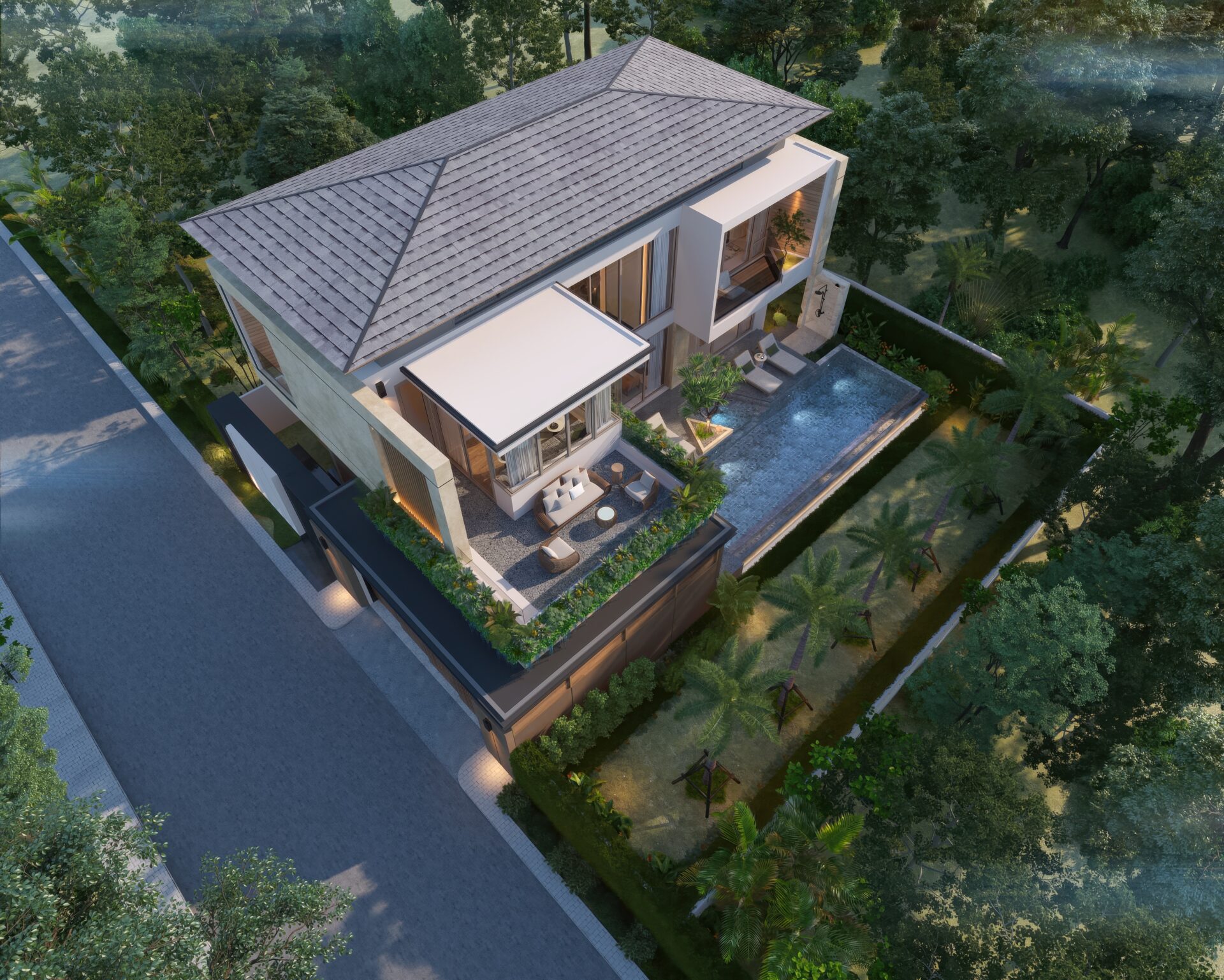 Aerial view of a modern two-story villa with a sloped tiled roof, glass walls, and a rectangular pool surrounded by lush greenery and trees.