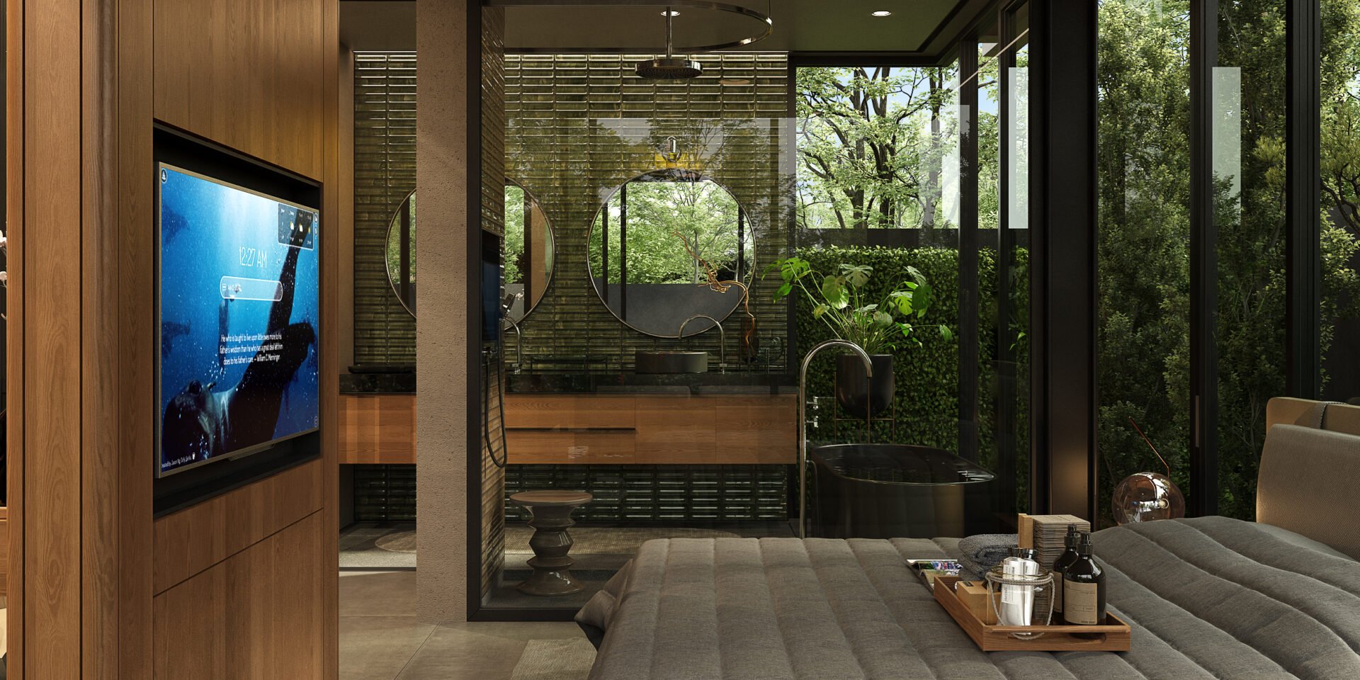 Luxurious hotel bedroom with a glass-walled ensuite, circular mirrors, and a drinks tray on the bed overlooking greenery outside.