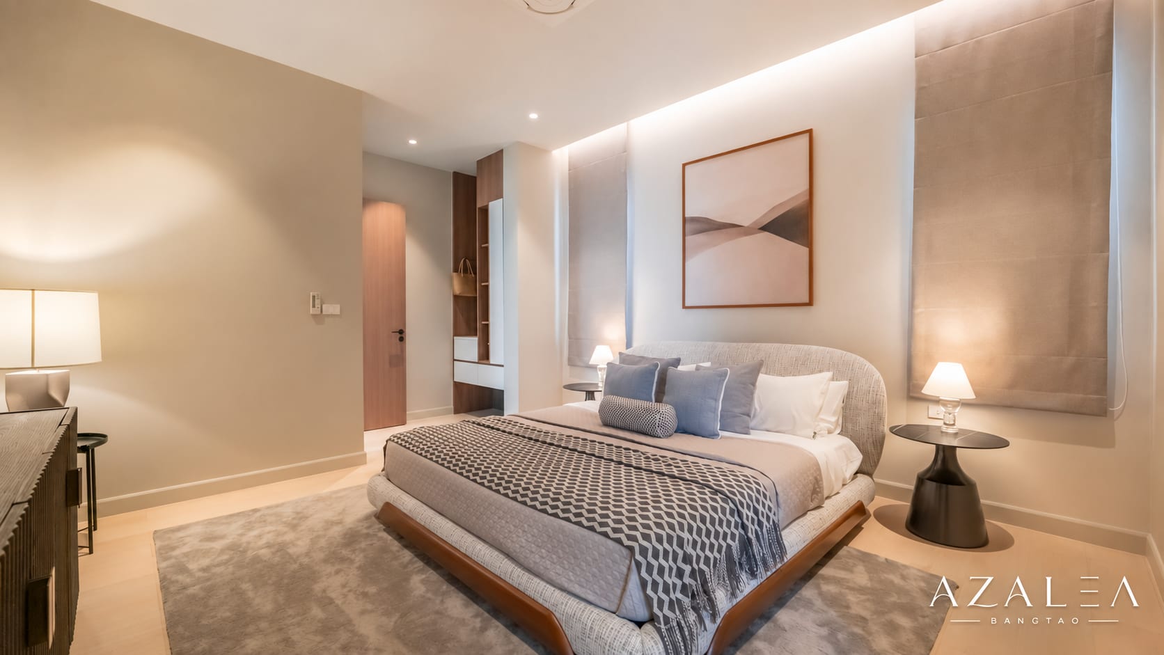 Luxurious hotel bedroom with king bed, neutral tones, and two round nightstands with lamps.